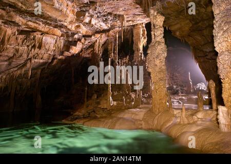 Stalagmites, stalactites and subterranean lake, Krizna Jama karst cave system, Loska Dolina, Slovenia Stock Photo
