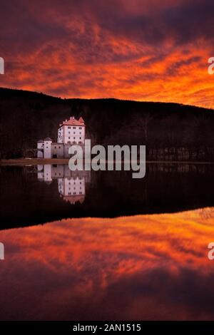 Sneznik Castle reflected in winter floodwater, near Kozarisce, Notranjska, Slovenia Stock Photo