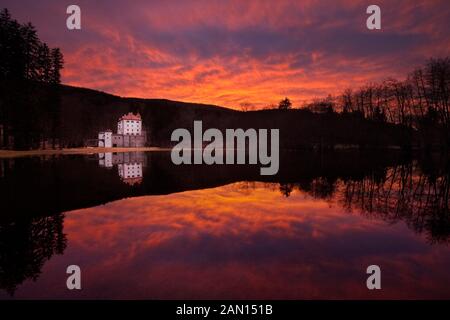 Sneznik Castle reflected in winter floodwater, near Kozarisce, Notranjska, Slovenia Stock Photo