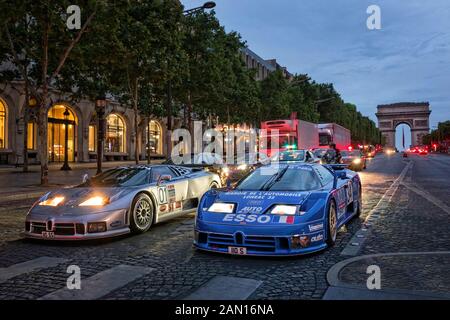 Bugatti EB110 Race cars on the Champs Elyse Paris Blue Car. 1994 LM Le Mans car. Silver Car 1995 GTS1 IMSA race car Stock Photo