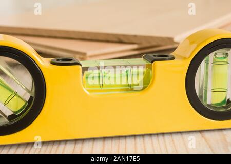 Close up of a work shop spirit level bubble ideal for DIY woodworking or carpentry concepts Stock Photo