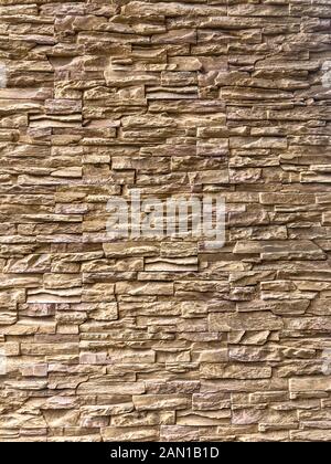 Classic Random Light brown brick arranged on the wall for decorate exterior of building. Stock Photo