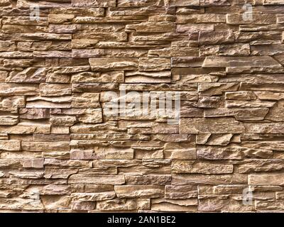 Classic Random Light brown brick arranged on the wall for decorate exterior of building. Stock Photo