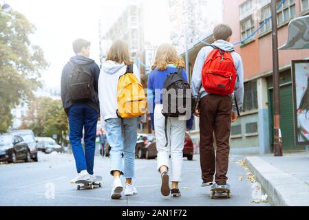 Friends walking on street Stock Photo