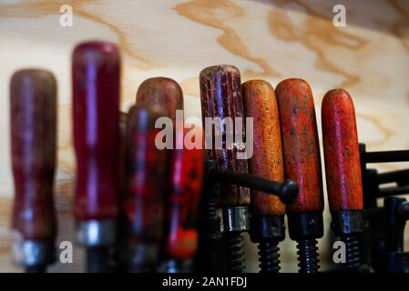 Hand tools hanging in workshop Stock Photo