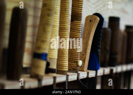 Hand tools hanging on pegboard Stock Photo