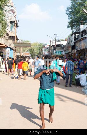 Local man walking in the street, Madurai, South India Stock Photo