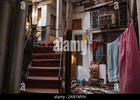 Courtyard of the old city residential building in Baku. Life of the population. Stock Photo