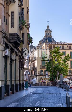 The ornate blue and white tiled dome and cupola of Iglesia del Salvador from Calle Cuesta del Rosario in Seville. Stock Photo