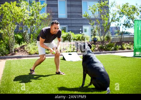 A man playing with his dog. Stock Photo