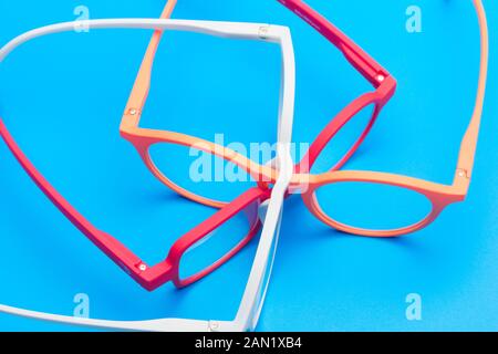Glasses and lenses graduated on a plain background, with graduated glasses to be able to see either from far or near or to enlarge the size of the let Stock Photo
