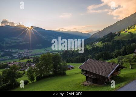 Sun sets over the Tuxer Alps in Tirol, Austria. Beautiful colors of the clouds and the alpine landscape. Stock Photo