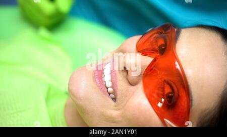 Smiling lady satisfied with dentist professionalism, dentistry for chipped tooth Stock Photo