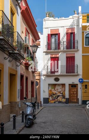 Colourful houses line the narrow Calle Espiritu Santo at its junction with Calle Castellar Stock Photo