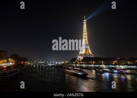 The Eiffel Tower lights up at midnight on New Years Eve 2020. Stock Photo