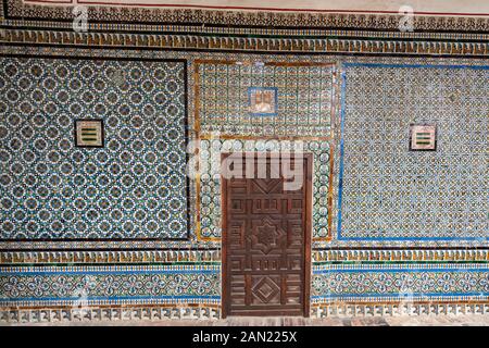 Ornate cuenca tiling and marquetry decorate the walls and doors of the 1539 Praetor's Room in the Casa de Pilatos. Stock Photo