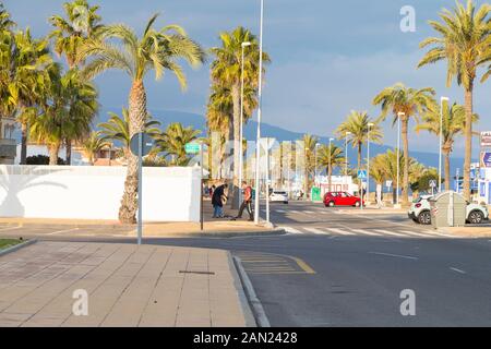 Palm tree lined street road, roquetas de mar, almeria, spain Stock Photo
