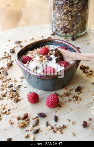 Skyr topped with Raspberries and homemade Granola. Stock Photo