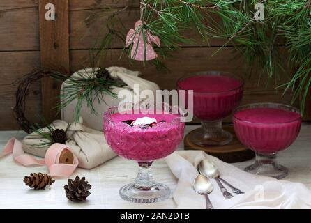Blackcurrant, orange and cream mousse in a glass bowl. Rustic style. Stock Photo