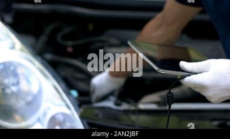Automotive Engineer Uses Digital Tablet with Augmented Reality for Car ...