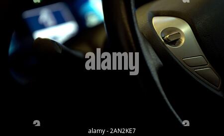 Steering wheel with source button, modern automobile transportation, closeup Stock Photo