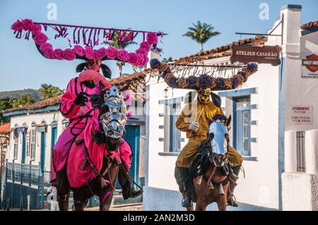 Cavalhadas and their masked people, in the city of Pirenópolis, Goiás, Brazil. Traditional popular celebration held at the Festa do Divino Stock Photo