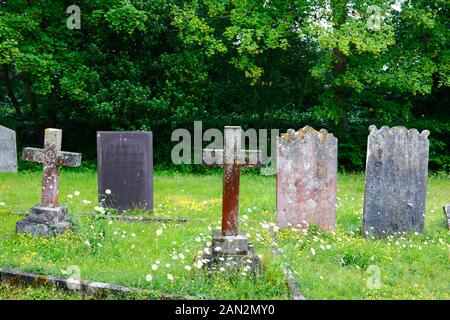 Cross tombstone with RIP (Rest In Peace) on it the old parish church of St Peter, Pembury, Kent, England Stock Photo