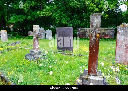 Cross tombstone with RIP (Rest In Peace) on it the old parish church of St Peter, Pembury, Kent, England Stock Photo