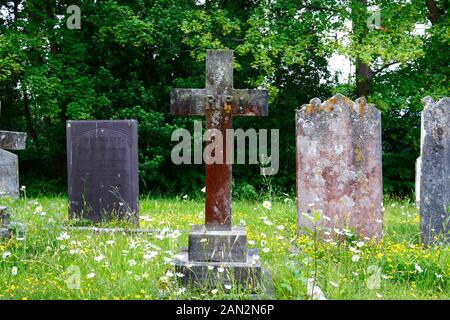 Cross tombstone with RIP (Rest In Peace) on it the old parish church of St Peter, Pembury, Kent, England Stock Photo