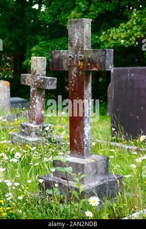 Cross tombstone with RIP (Rest In Peace) on it the old parish church of St Peter, Pembury, Kent, England Stock Photo