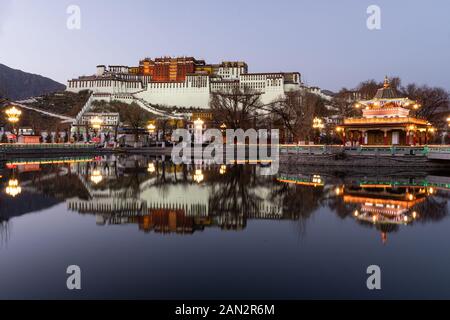 Stunning twilight over the famous Potala Palace in Lhasa old town in Tibet, China Stock Photo