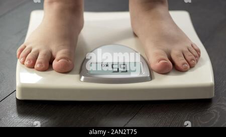 Female Bare Feet Standing On A Digital Scales. Weight Loss Stock Photo,  Picture and Royalty Free Image. Image 84250838.