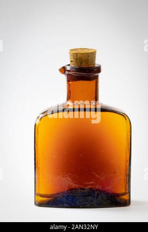 Vial, a tiny chemist's bottle, vintage pharmacy or drugstore equipment. Stock Photo