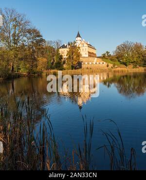 Radun chateau mirroring on pond water ground near Opava city in Czech republic during nice autumn day Stock Photo