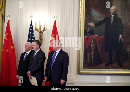 Washington, USA. 15th Jan, 2020. President Donald Trump listens as Chinas Vice Premier Liu He (not shown) speaks, during a press conference, before they sign a trade agreement with the US and China during a ceremony in the East Room of the White House on January 15, 2020 in Washington, DC. Next to Trump, Vice President Mike Pence and US Trade Representative Robert Lighthizer. (Photo by Oliver Contreras/SIPA USA) Credit: Sipa USA/Alamy Live News Stock Photo