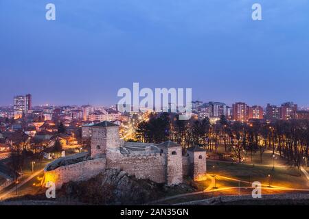 Beautiful panorama of Pirot cityscape, with foreground ancient fortress Momcilov grad and city buildings and houses in the background Stock Photo