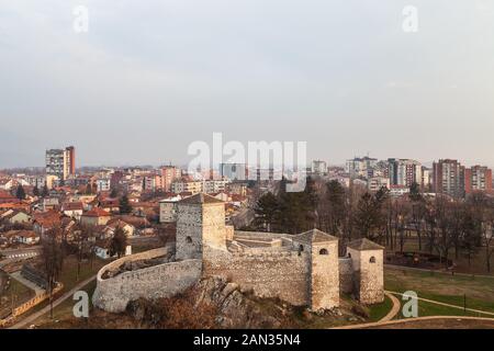 Beautiful panorama of Pirot cityscape, with foreground ancient fortress Momcilov grad and city buildings and houses in the background Stock Photo