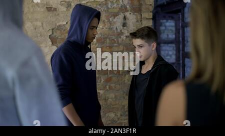 High school student bullying junior, humiliation, aggression against weaker Stock Photo