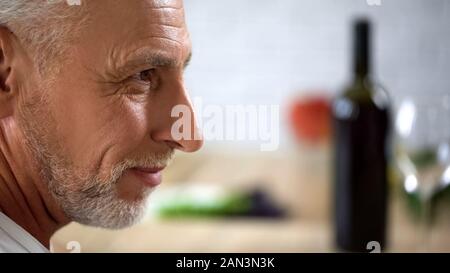 Grey-haired handsome male face closeup, good-looking aged man smiling background Stock Photo