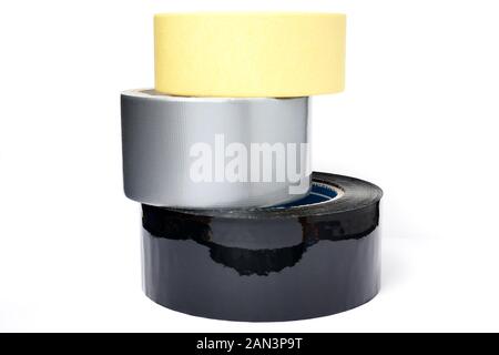 Rolls of insulation adhesive tape; Gray reinforced adhesive tape, yellow adhesive tape, black adhesive tape on white background Stock Photo