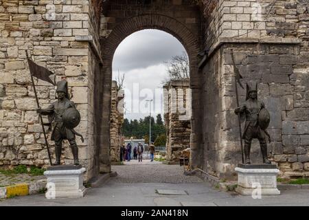 Topkapi, Istanbul / Turkey - January 13 2020: Eastern roman byzantine walls surrounding historical old Istanbul peninsula. Ottoman Soldier statue Stock Photo