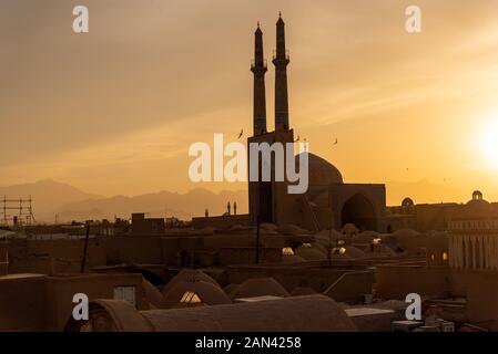 Views of the skyline with minarets and domes of Yazd at sunset, Iran Stock Photo