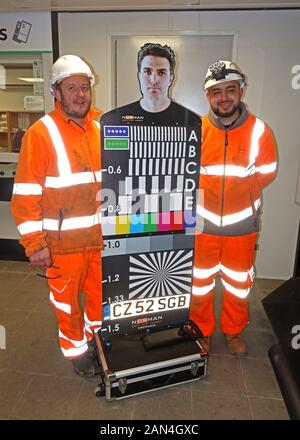 Railway contractors with a Norman CCTV Test Target - National Operational Requirement Mannequin, used for CCTV installation and calibration Stock Photo