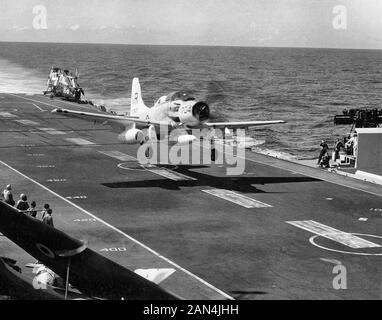 EA-1F Skyraider of VAW-13 Det.63 of approaches USS Kitty Hawk (CVA-63 ...