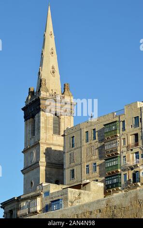 The tower of St Paul's Anglican pro-Cathedral above Marsamxett Harbour in Valletta, Malta. It was commissioned by Queen Adelaide in 1839. Stock Photo