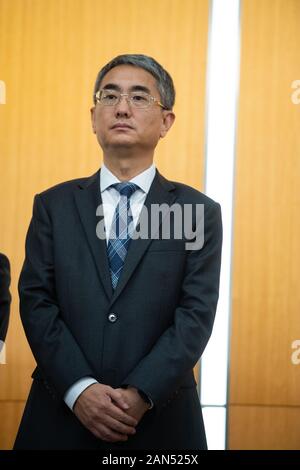 Cheong Weng Chon, Secretary for Administration and Justice, poses for photos after the press conference at the Macao Government Headquarters in Macao, Stock Photo