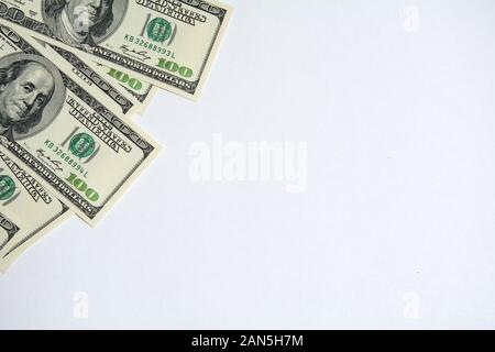 US dollar money cash currency background. American Dollars 100 banknote border in the corner . One hundred US dollar banknotes isolated on white backg Stock Photo