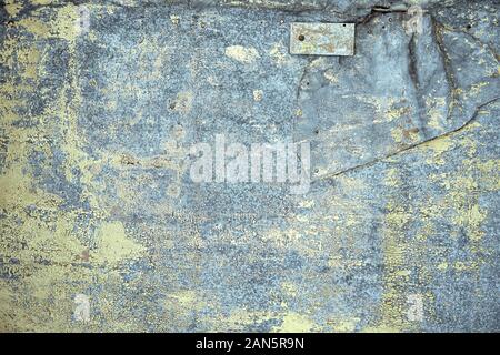 galvanized metal texture with old peeling paint. Metal background, copyspace. view from above. Stock Photo