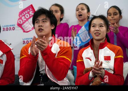 Lausanne, Switzerland. 15th Jan, 2020. Wang Yuchen (R)/Huang Yihang of China from Team Future wait for their score during the Mixed NOC Team competition of figure skating event at the 3rd Winter Youth Olympic Games in Lausanne, Switzerland, Jan. 15, 2020. Credit: Wang Jianwei/Xinhua/Alamy Live News Stock Photo