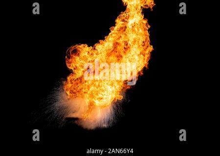 Flames caused by the explosion of the oil. Demonstration of water on oil fire. Stock Photo